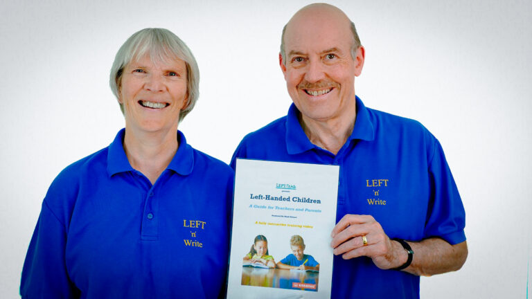 Mark and Heather Stewart holding their newly published left-handed training resource for teachers and parents. A instructional guide designed to help teachers and parents with left-handed children.